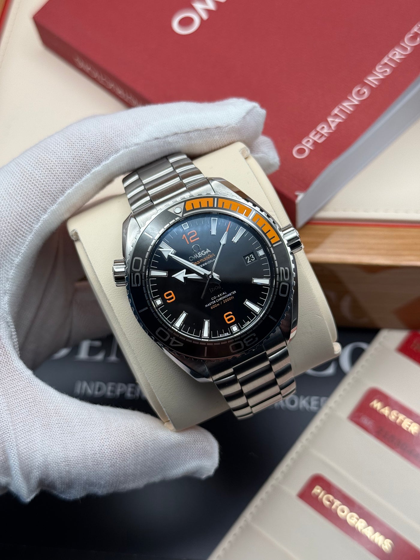 A watch being carefully handled by Benly & Co